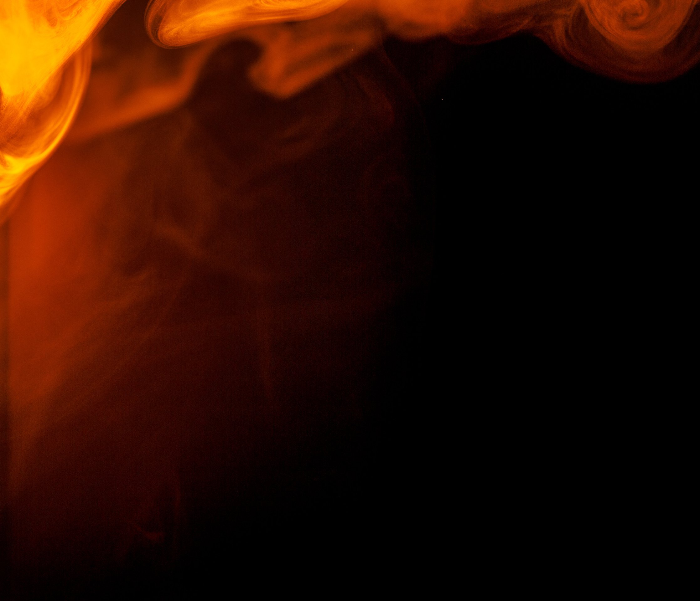 Abstract Orange Smoke Hookah on a Black Background.